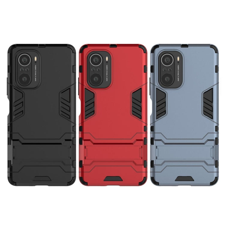 Shockproof protective phone cases in red, black, and gray with camera cutouts