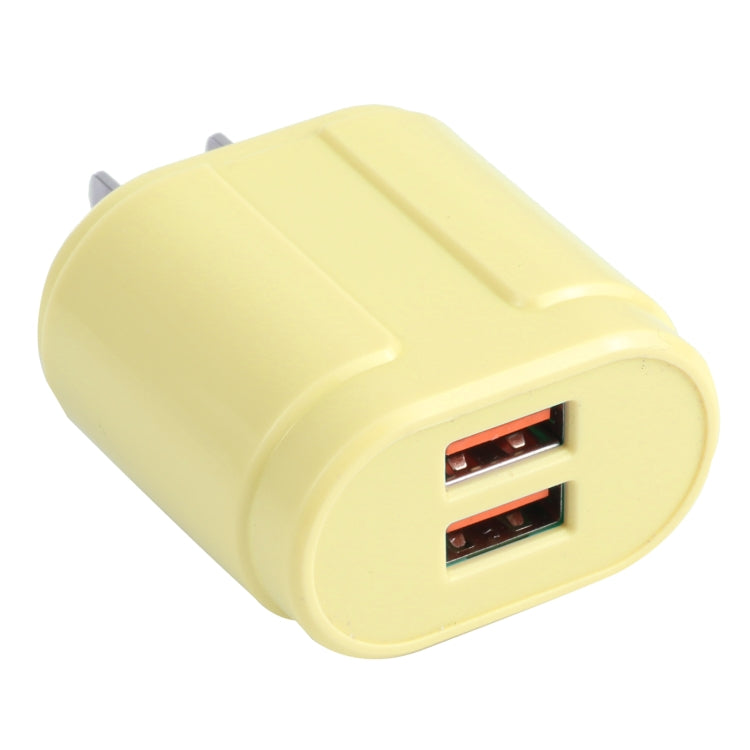 Yellow dual USB travel charger with 2 ports and plug prongs