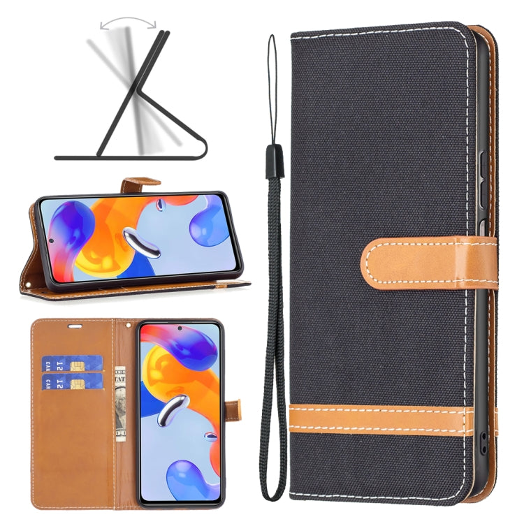 Dark gray denim-texture phone wallet case with tan strap, stitching, and wrist lanyard.