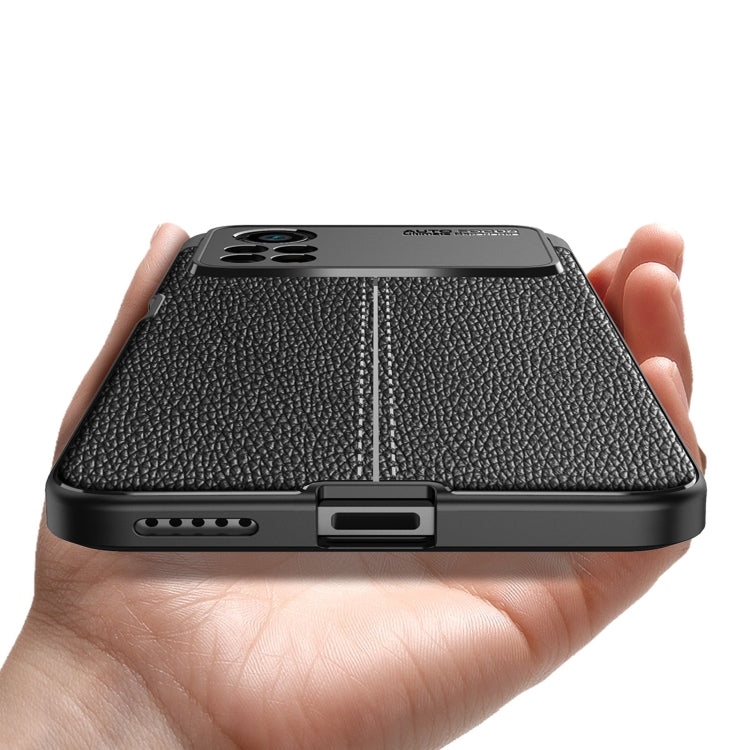 Black litchi-texture TPU phone case showing bottom charging and speaker openings