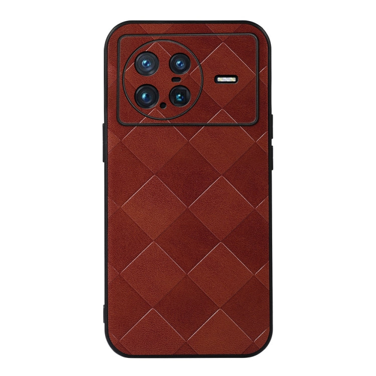 Brown PU phone case with quilted plaid pattern, camera cutout and side button openings