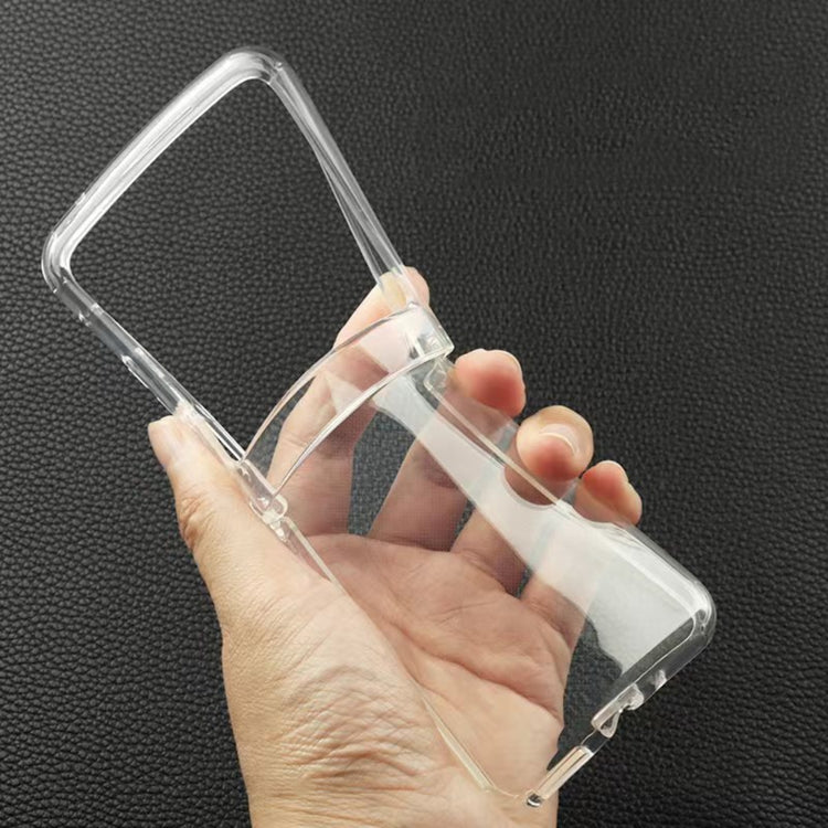 Transparent TPU phone case, held in hand, flexible bumper with side cutouts