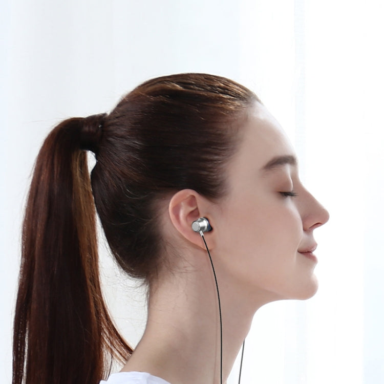 Woman wearing black wired in-ear earbud with attached microphone cable
