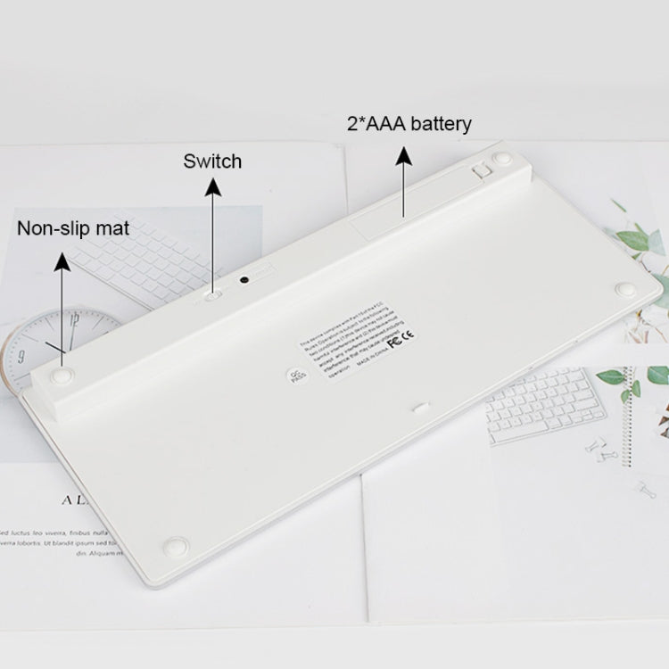 Flat lay of thin mini wireless keyboard with non-slip mat and battery area