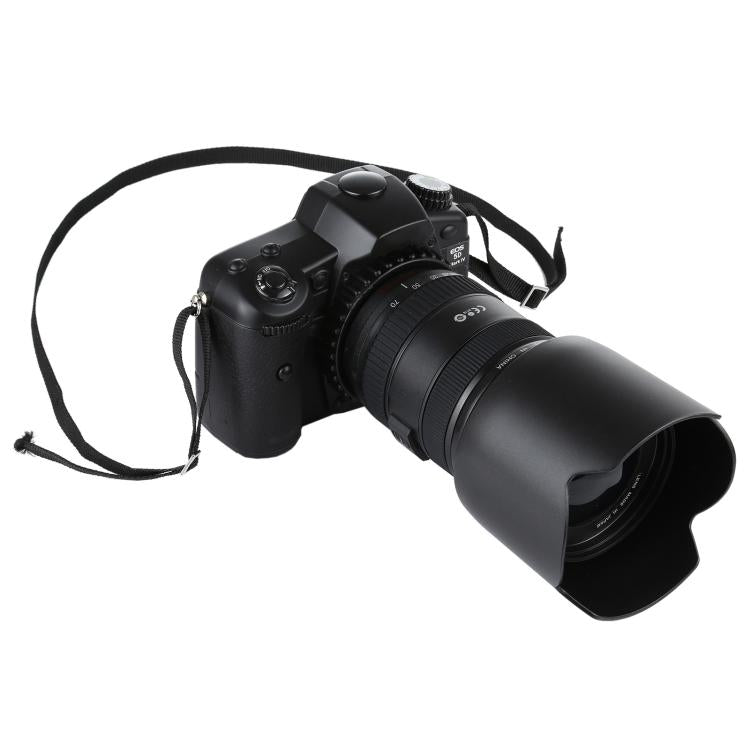Black fake DSLR camera prop with lens hood and strap.
