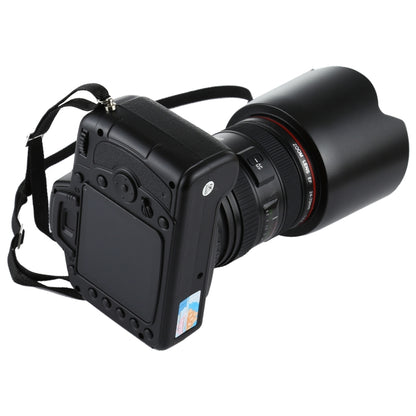 Black fake DSLR camera prop from side view with large lens hood.