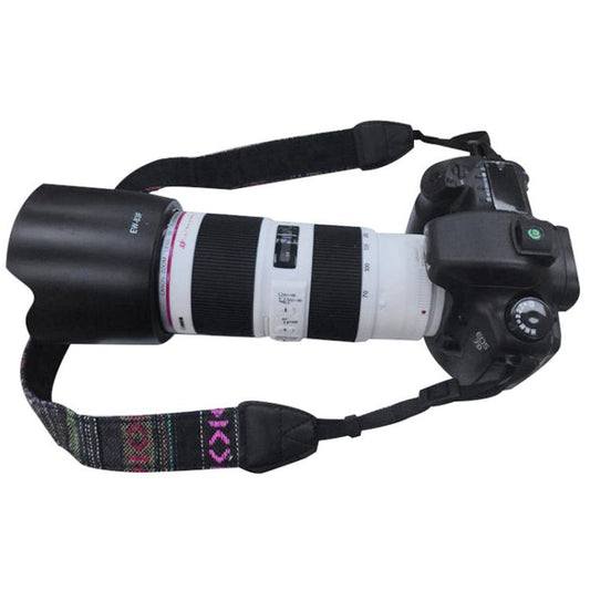 Black camera dummy with white 70-200 telephoto lens and fabric strap