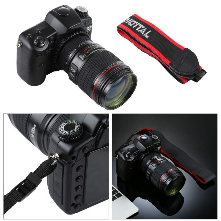 Black DSLR camera prop with zoom lens and red shoulder strap, side angle