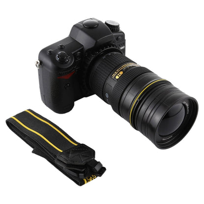 Black DSLR dummy camera with zoom lens and black-and-yellow strap