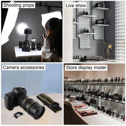 Black DSLR dummy camera prop with strap displayed with other photo studio props