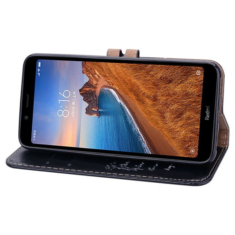 Black leather flip phone case with visible screen window and side camera cutout