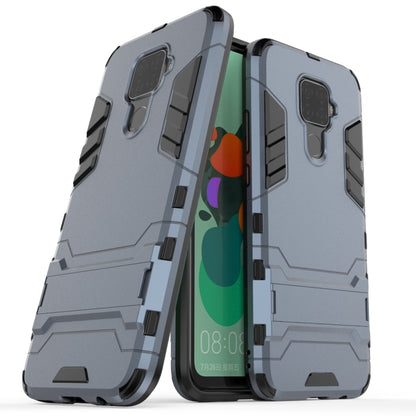 Rugged shockproof phone case with raised edges and camera cutout, light blue-gray