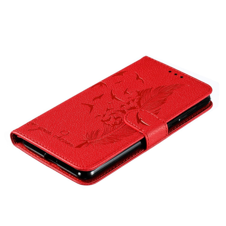 Red faux-leather flip phone case with feather emboss, front cover folded for protection.