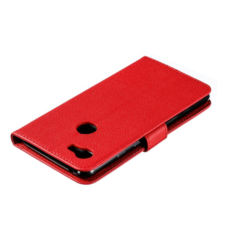 Red faux-leather flip phone case with camera holes and cover folded over phone.