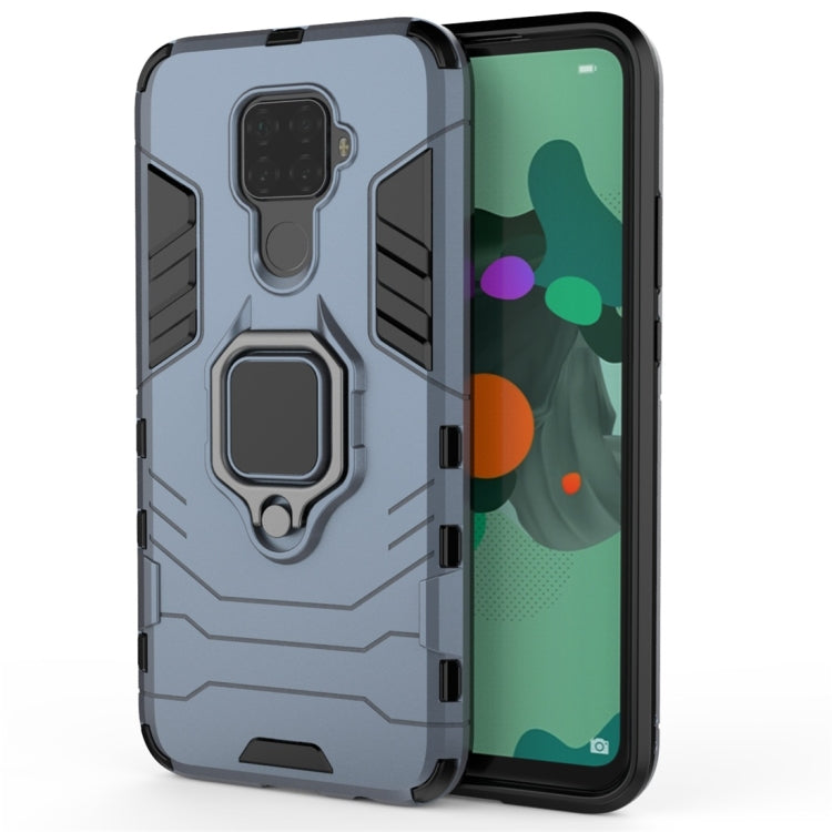 Navy blue protective phone case with magnetic ring holder, textured sides, and cutouts