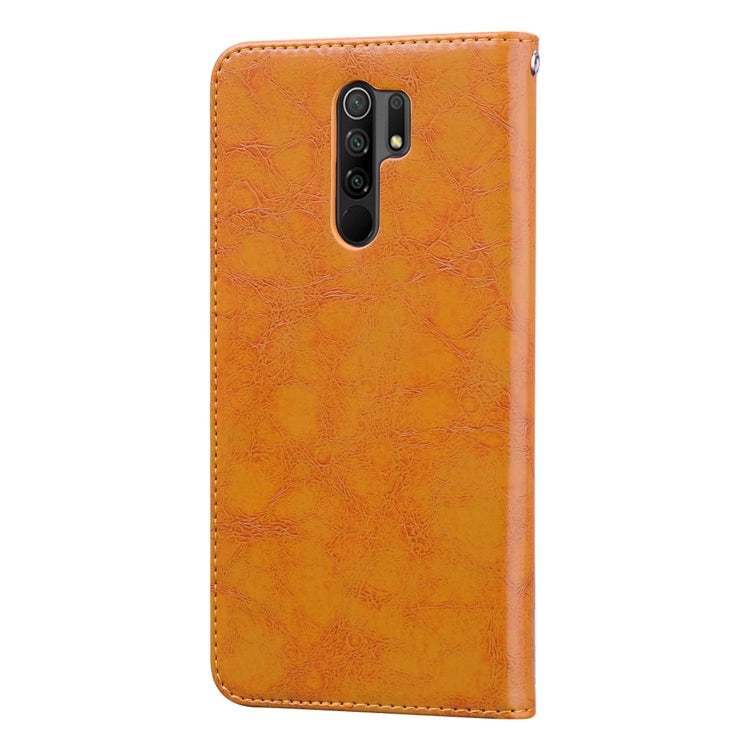 Orange textured leather phone case with camera cutout and protective back