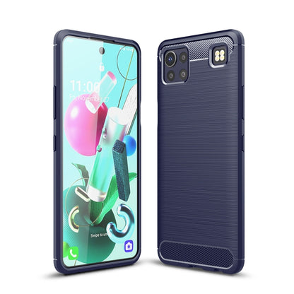 Navy blue carbon fiber-style TPU phone case with textured back and camera cutout