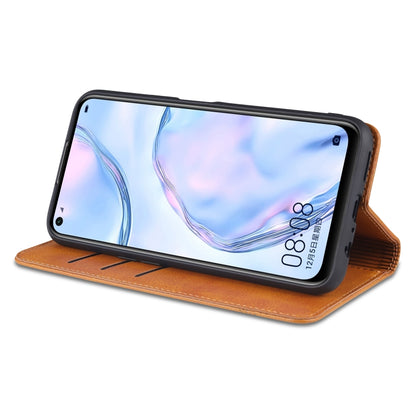 Orange-brown leather flip phone case with magnetic closure showing phone screen