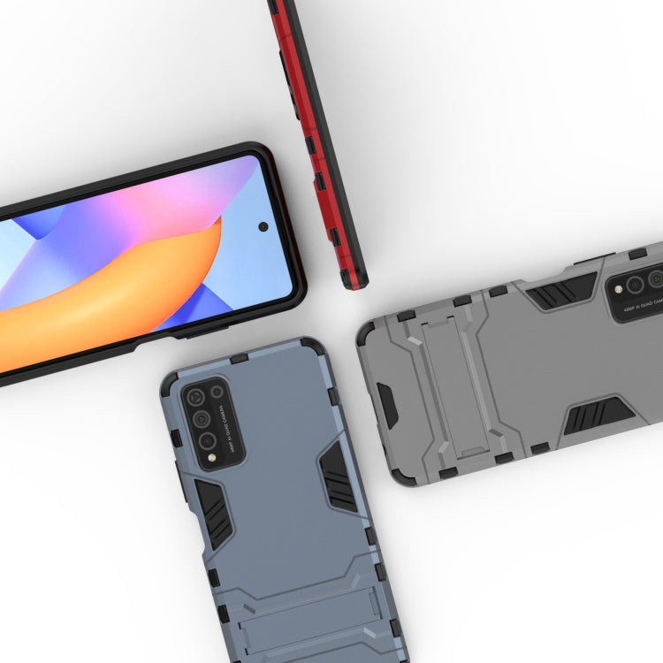Shockproof navy phone case with holder; side buttons and camera cutout visible