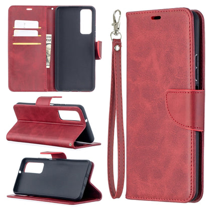 Red leather wallet phone case with flip cover, card slots, and wrist lanyard strap