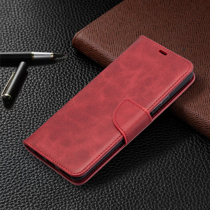 Red leather folio phone case with magnetic-closure flap and card holder panel