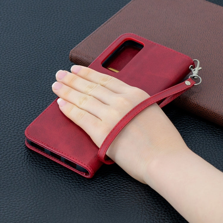 Red leather wallet phone case with hand grip, flip cover and side card slots