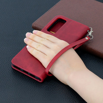 Red leather wallet phone case with hand grip, flip cover and side card slots