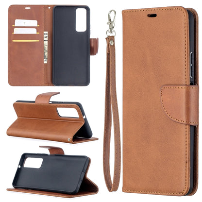 Brown flip leather phone case with card slots and wrist lanyard, stand feature.