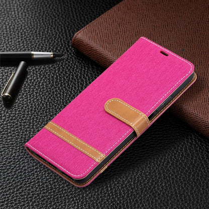 Pink flip leather phone case with card slots and stitched belt-style strap