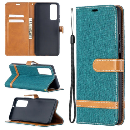 Teal denim-texture phone wallet case with flip cover, card slots, and wrist strap