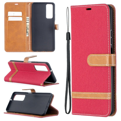 Red denim-texture phone wallet case with flip cover, card slots, and wrist strap