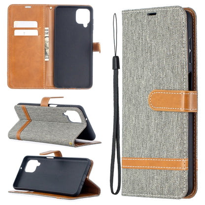 Grey denim flip phone case with leather card slots, horizontal stand, wrist lanyard