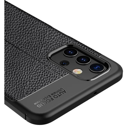 Black litchi-texture TPU phone case close-up of triple camera module and accents