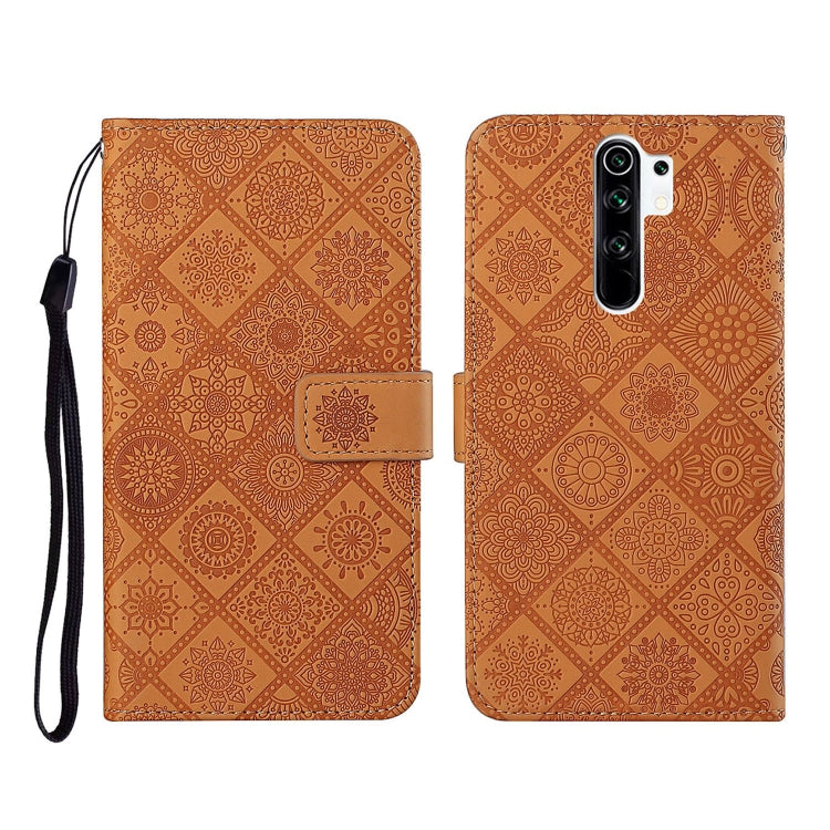 Brown embossed leather flip phone case with card slots and wrist lanyard strap