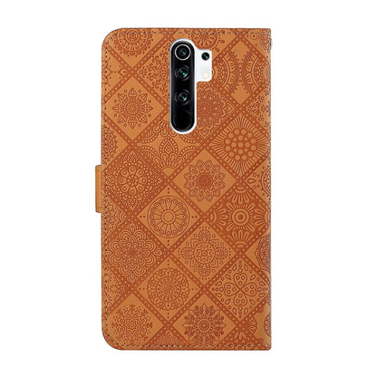 Brown embossed leather flip phone case with camera cutout and magnetic clasp