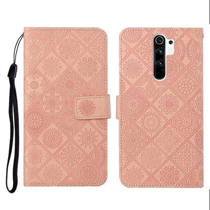 Pink embossed leather flip phone case with card slots and wrist lanyard strap