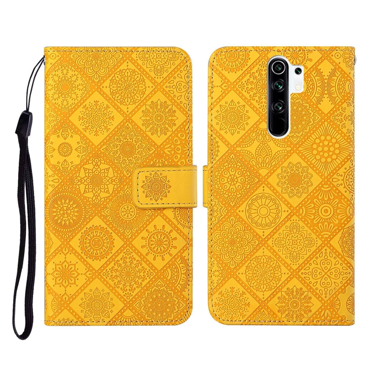 Yellow embossed leather flip phone case with card slots and wrist lanyard strap