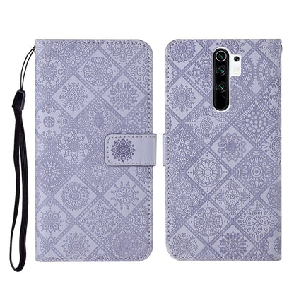 Purple embossed flip leather phone case with card holder and black wrist strap