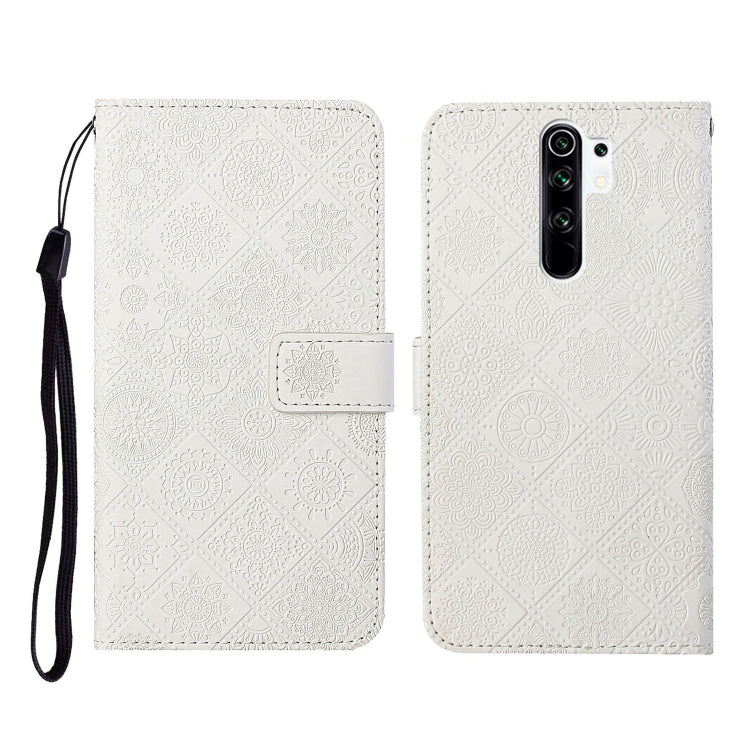 White embossed flip leather phone case with card holder and black wrist strap