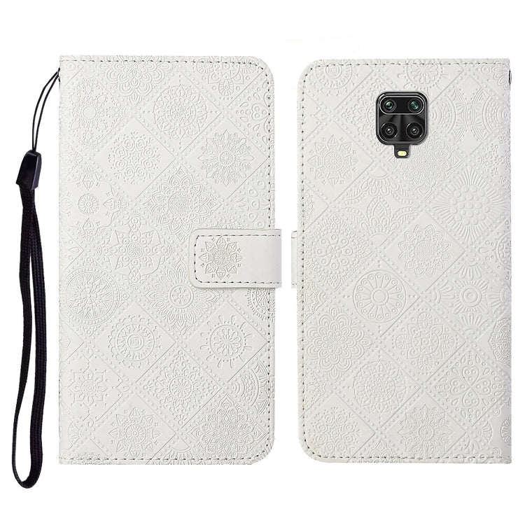 White embossed flip leather wallet phone case with card slots and wrist lanyard