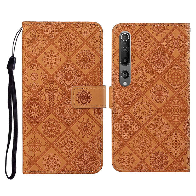 Orange embossed flip leather wallet phone case with card slots and wrist lanyard