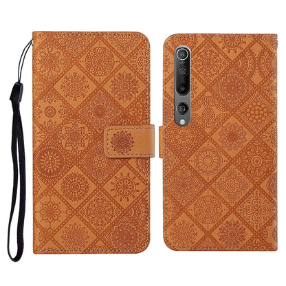 Orange embossed flip leather wallet phone case with card slots and wrist lanyard