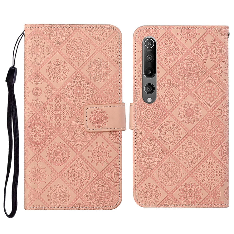 Pink embossed flip leather wallet phone case with card slots and wrist lanyard