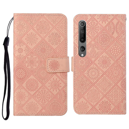 Pink embossed flip leather wallet phone case with card slots and wrist lanyard