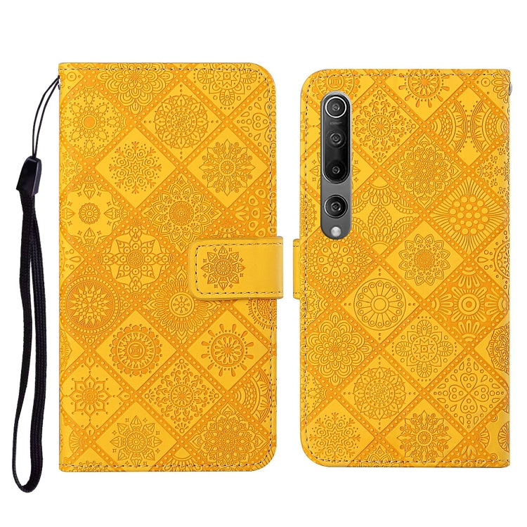 Yellow embossed flip leather wallet phone case with card slots and wrist lanyard
