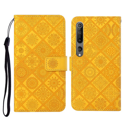 Yellow embossed flip leather wallet phone case with card slots and wrist lanyard