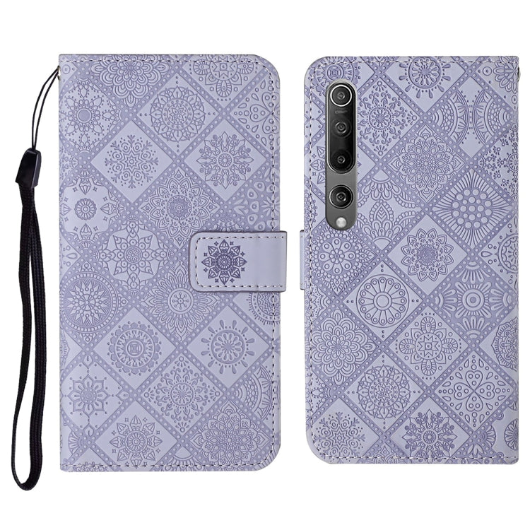 Purple embossed flip leather wallet phone case with card slots and wrist lanyard