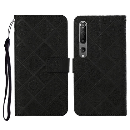 Black embossed flip leather wallet phone case with card slots and wrist lanyard