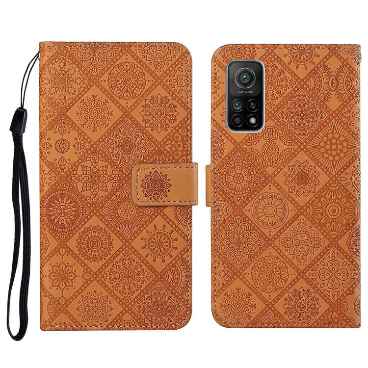 Brown embossed flip phone wallet case with card holder and wrist lanyard strap