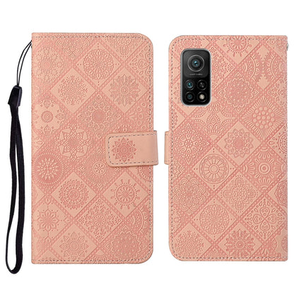 Light pink embossed flip phone wallet case with card holder and wrist lanyard strap